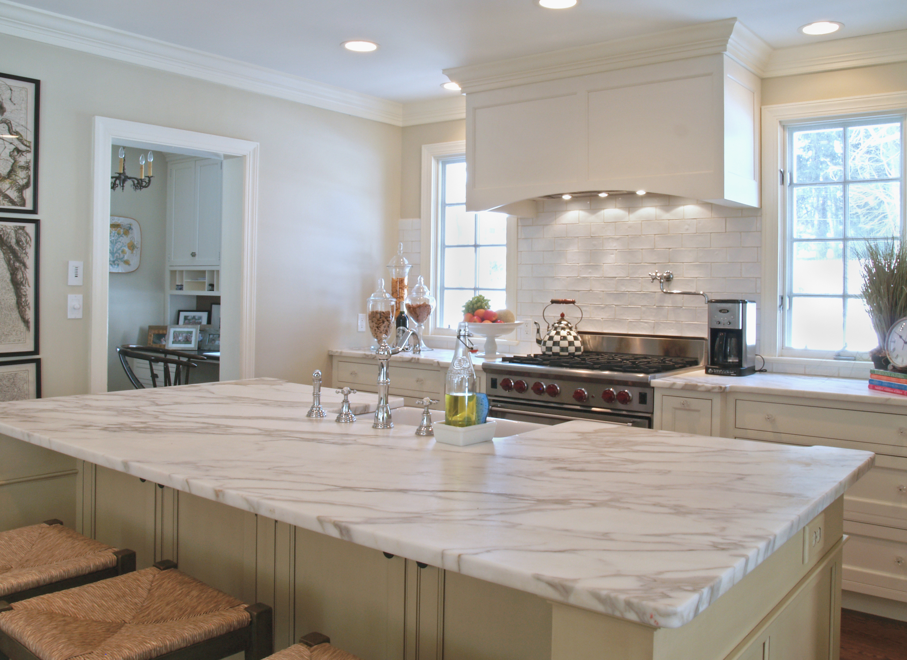 private site white marble countertops granite cabinets stained island